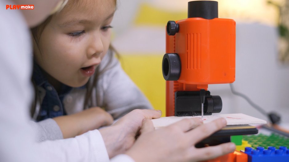 Children working with the PLAYmake drill press